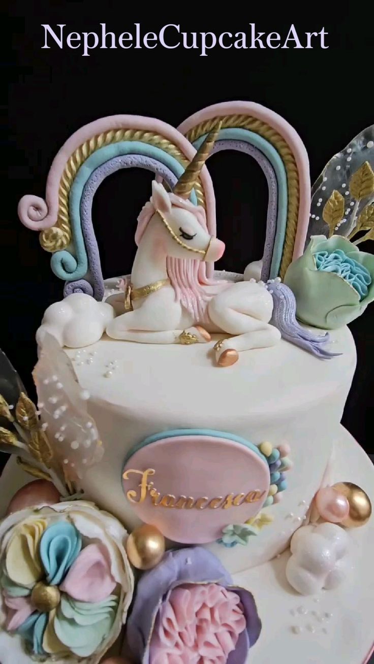 Nephele Cupcake Art — unicorn fondant cake with rainbow, pastel florals, and gold accents